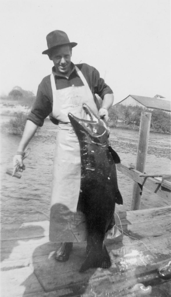 Fisherman with Caught Chinook Salmon