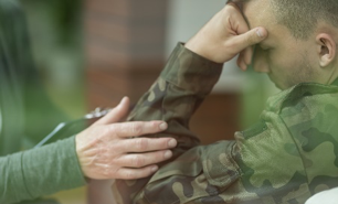 A military person being consoled