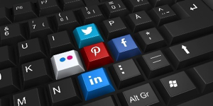 Keyboard with superimposed social network website logoes replacing several keys