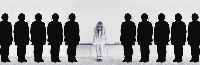 young woman sitting on a bench surrounded by silhouetted figures