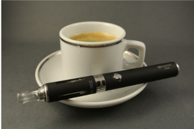 A cup of coffee with a vaping pen