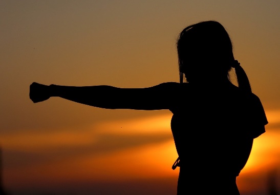 image of a woman in a self defence posture