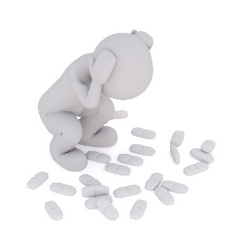 illustration of a human crouching over pills spilled on the floor