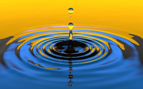 a drop of water splashing and forming concentric circles