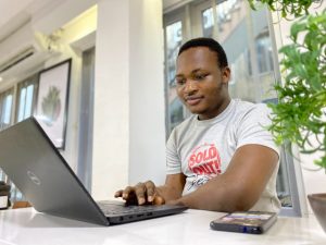 African male on laptop