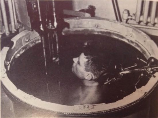 man submerged in water during ultrasound exam