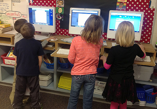 Students using computers in classroom