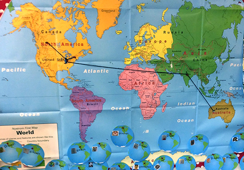 Wolrd map with notes and pins showing connections students have made around the world