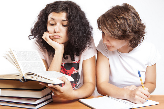 Two college students studying