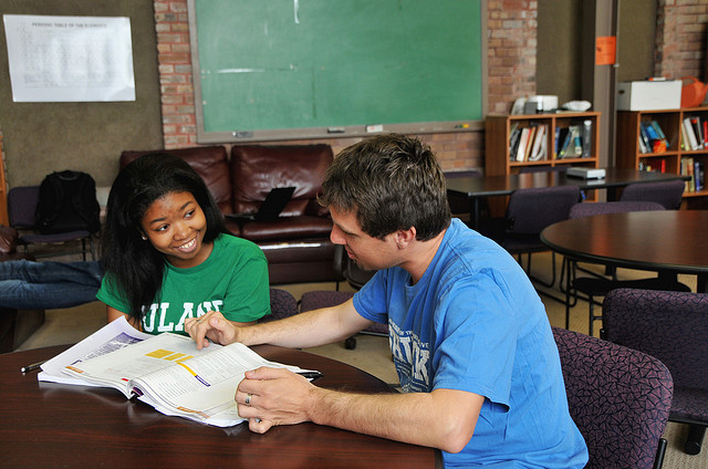 Two college students working on a homework problem together