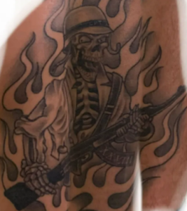 A photograph of an "executioner" tattoo.
